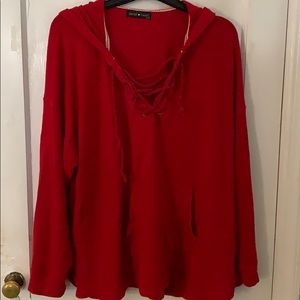 Red hoodie with rope detail.